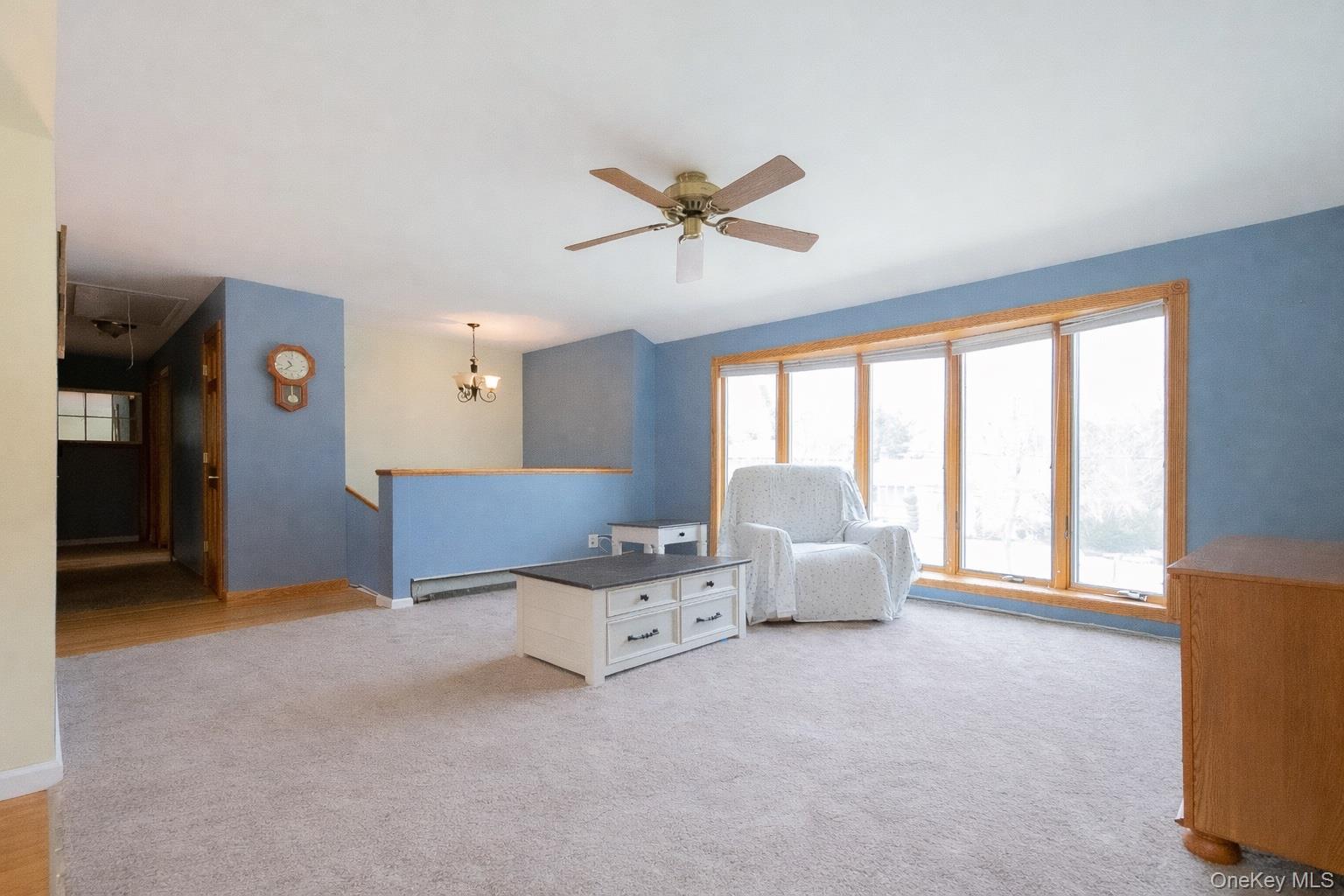 4 Manchester Drive Bethpage, NY 11714 - Photo 2 of 26 a living room with furniture and windows