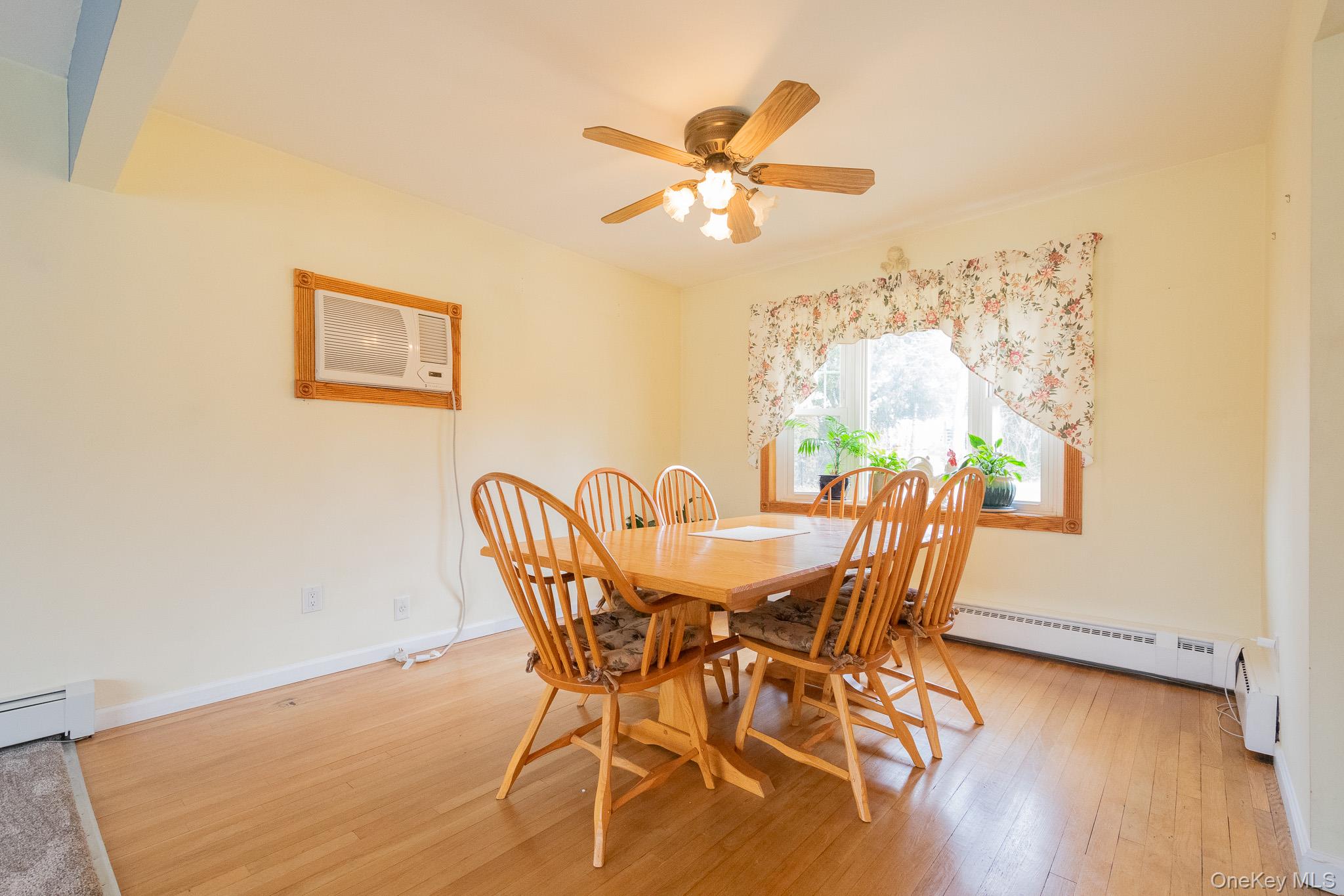 4 Manchester Drive Bethpage, NY 11714 - Photo 5 of 26 a view of a dining room with furniture and wooden floor