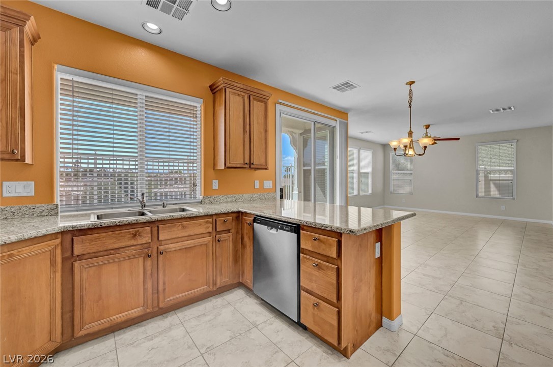 977 Sparkling Light Street Henderson, NV 89052 - Photo 31 of 75 This bright kitchen features ample counter space and a convenient layout for everyday living.