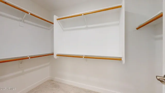 an empty room with a empty space and a ceiling fan