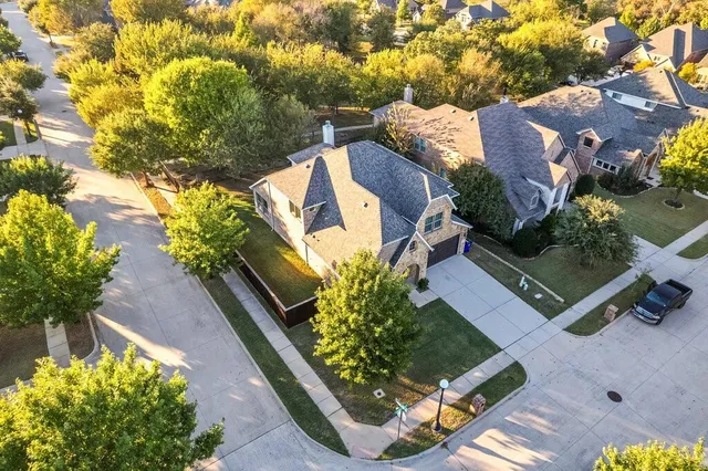 an aerial view of a house with a garden