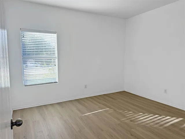 a view of a room that has a window in it