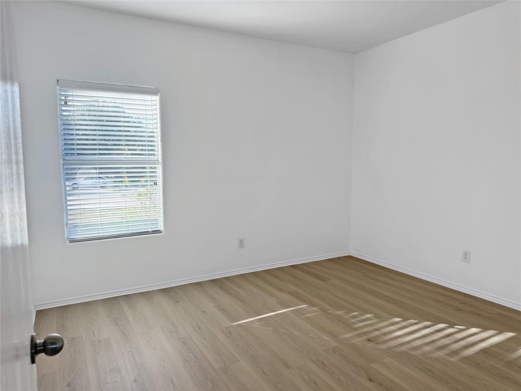 7537 Lazy Spur Boulevard Fort Worth, TX 76131 - Photo 11 of 24 a view of a room that has a window in it