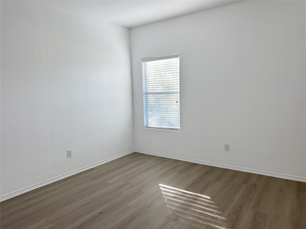 7537 Lazy Spur Boulevard Fort Worth, TX 76131 - Photo 13 of 24 an empty room with a window
