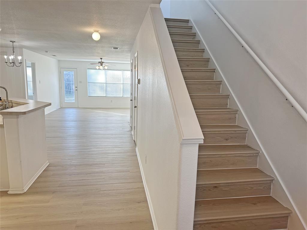 7537 Lazy Spur Boulevard Fort Worth, TX 76131 - Photo 19 of 24 a view of entryway and hall with wooden floor
