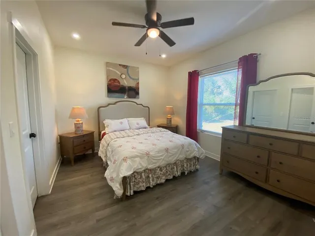 a bedroom with a bed and a dresser