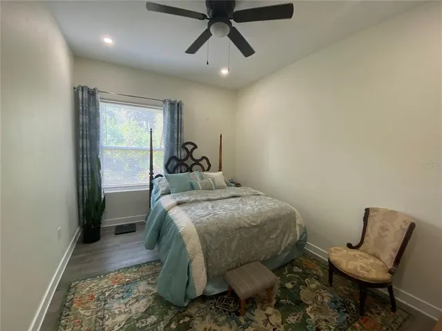 a bed room with a bed and a window