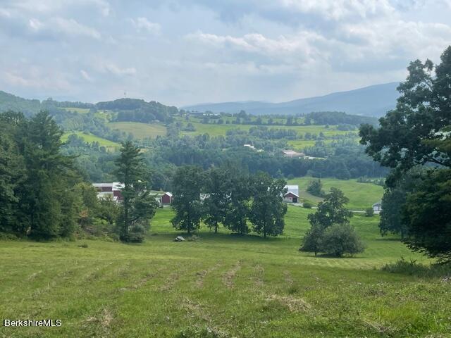 2437 North Pownal Road Pownal, VT 05261 - Photo 7 of 19 a view of a green field with lots of trees