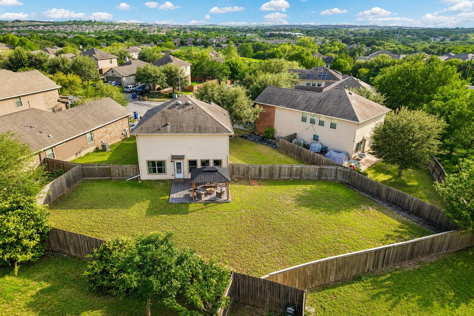 5508 Emma Thompson Way Austin, TX 78747 - Photo 2 of 34 A bird’s-eye view of one of this home’s most compelling features — an oversized backyard with endless potential for entertaining, relaxing, gardening, or creating your ideal outdoor retreat.