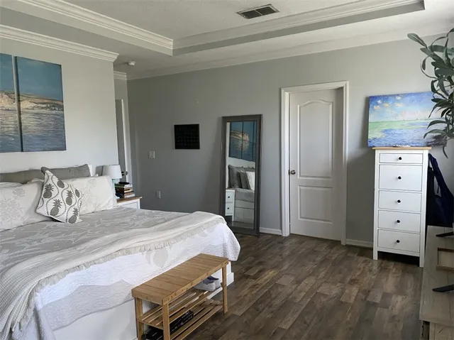 a bedroom with a bed and a dresser