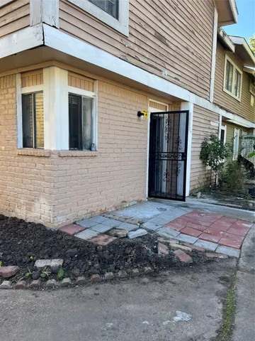 a view of a backyard of the house