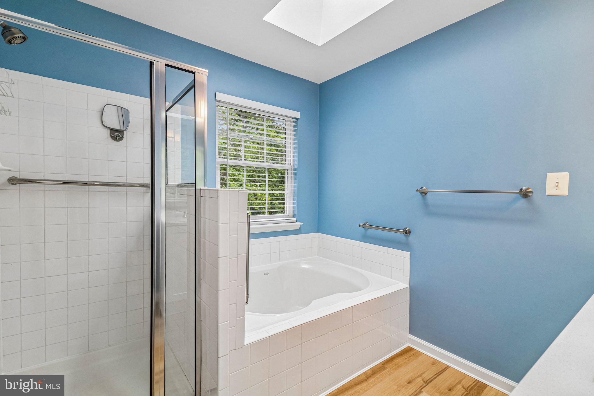 217 Braxton Way, Unit 217 Edgewater, MD 21037 - Photo 14 of 27 a bathroom with a tub and shower