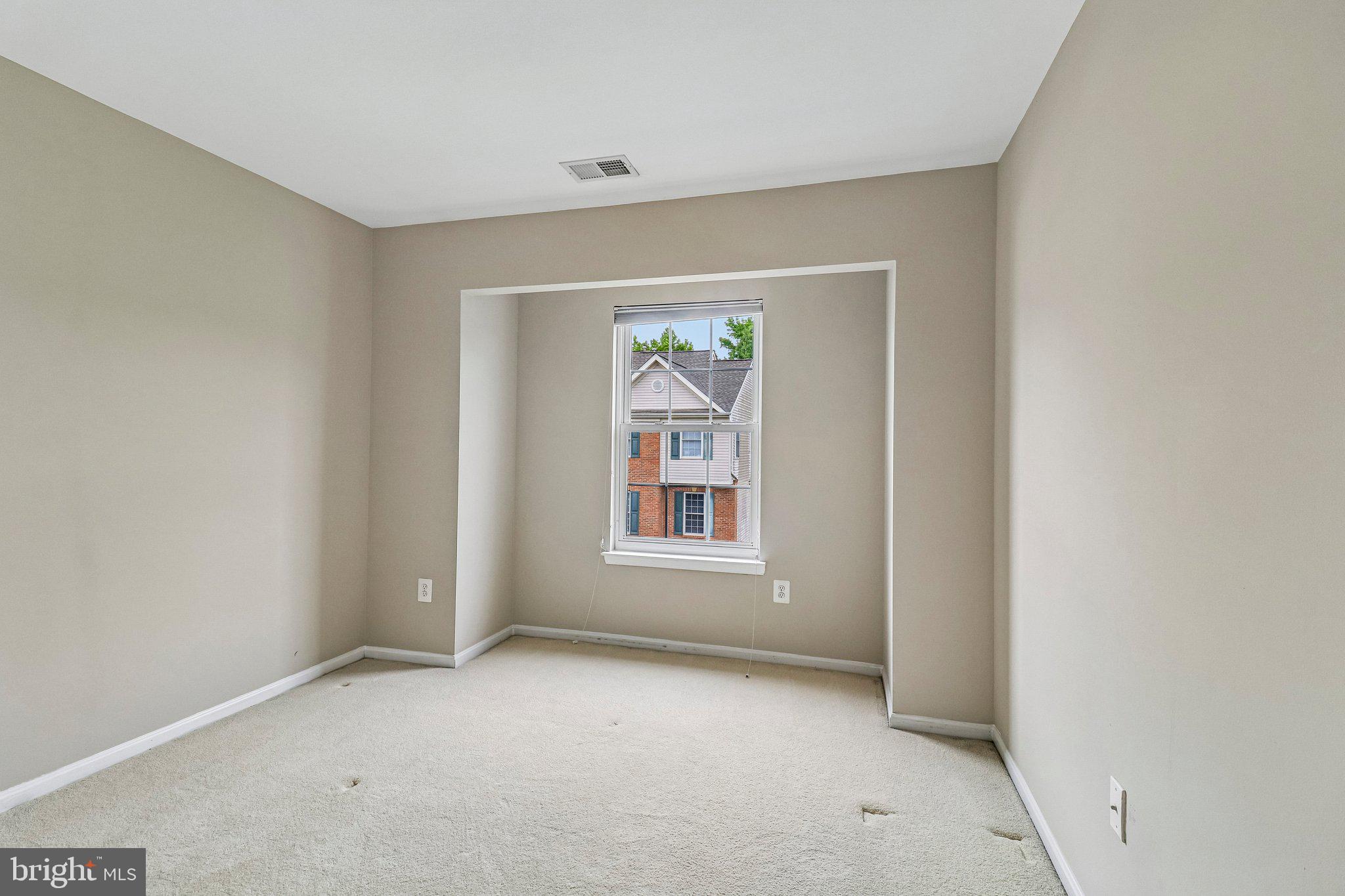 217 Braxton Way, Unit 217 Edgewater, MD 21037 - Photo 16 of 27 a view of an empty room with a window