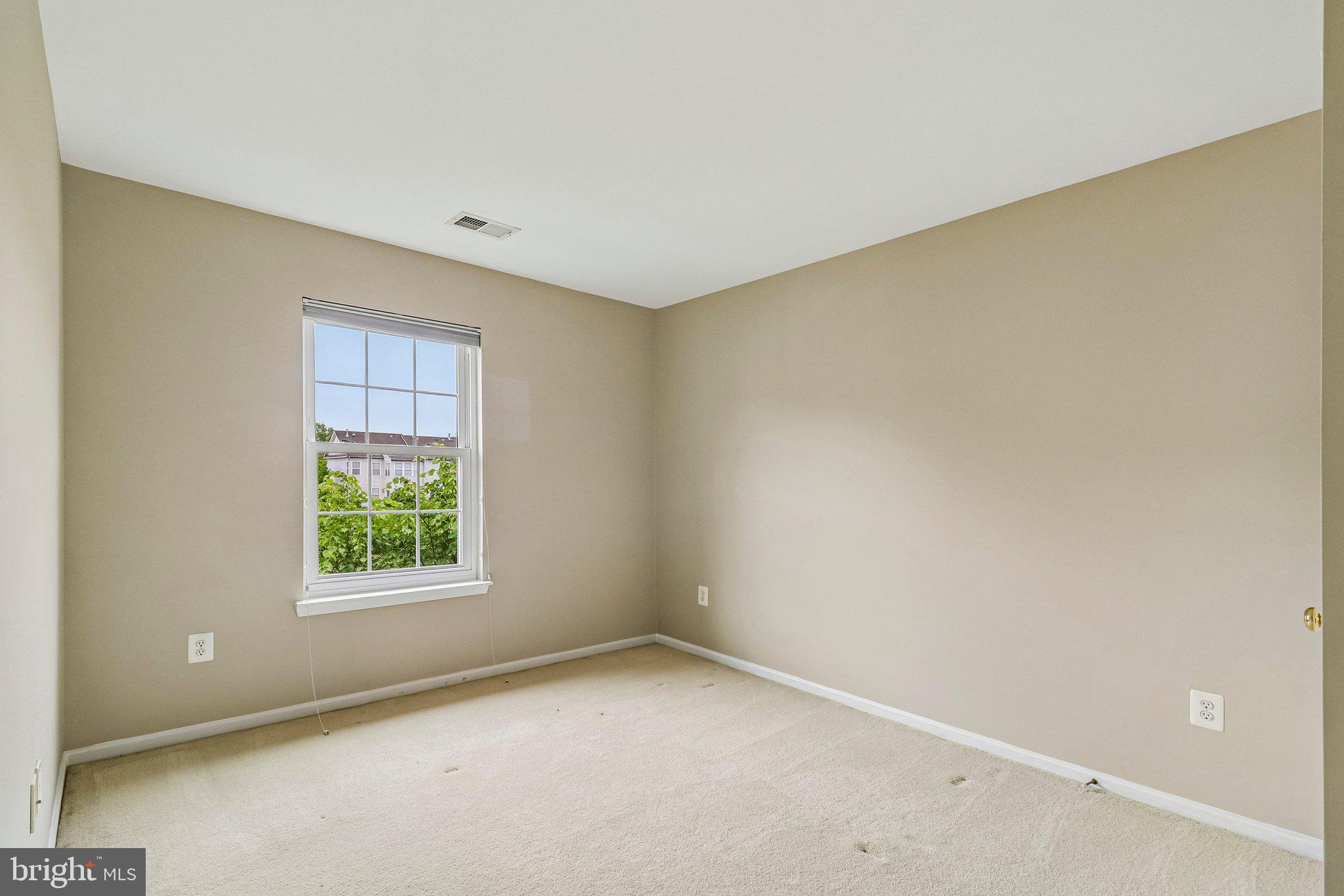 217 Braxton Way, Unit 217 Edgewater, MD 21037 - Photo 17 of 27 an empty room with windows