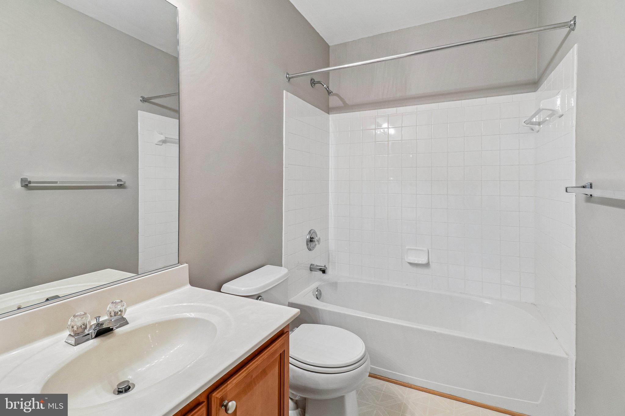 217 Braxton Way, Unit 217 Edgewater, MD 21037 - Photo 18 of 27 a bathroom with a sink toilet and shower