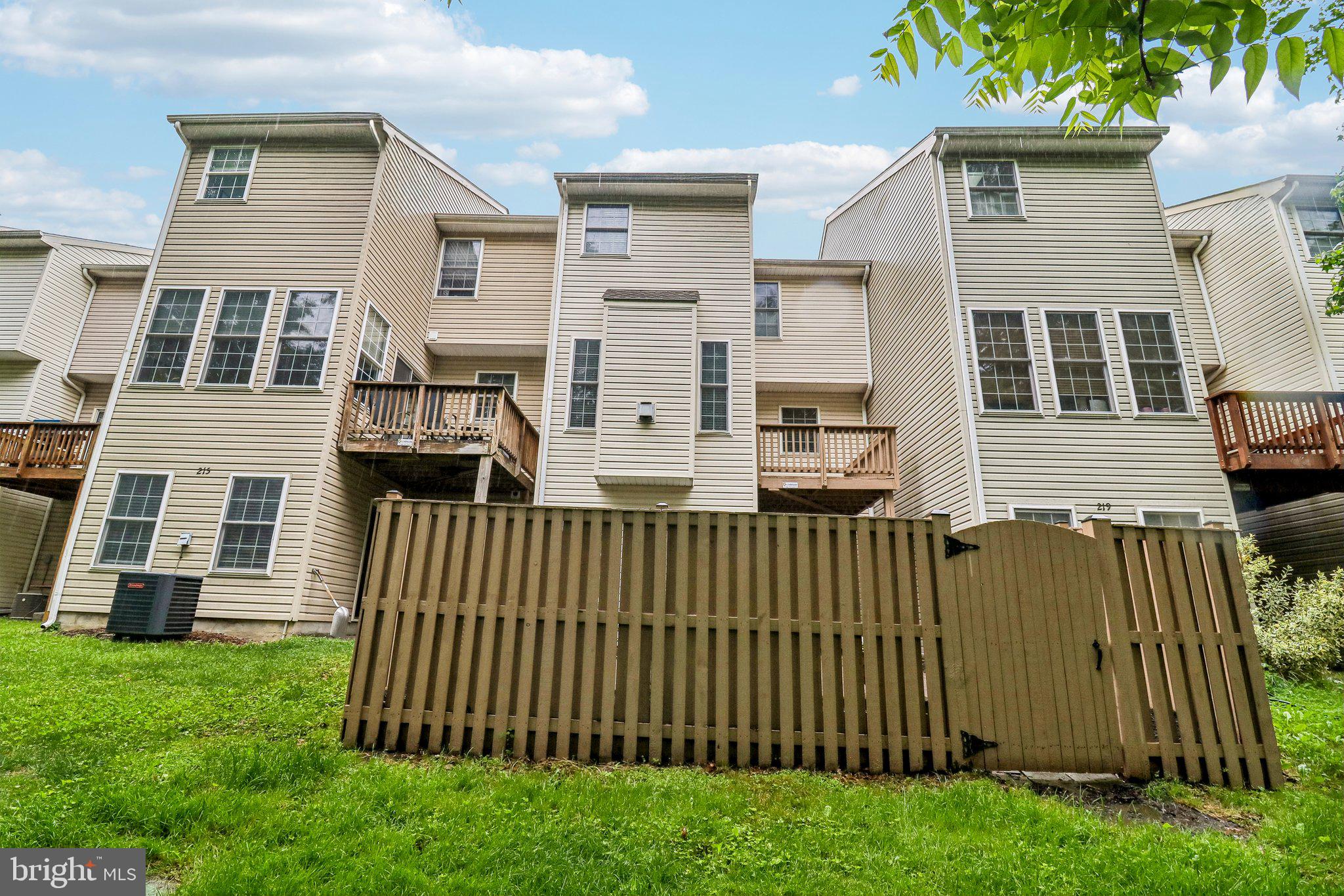 217 Braxton Way, Unit 217 Edgewater, MD 21037 - Photo 24 of 27 a front view of a house with a garden