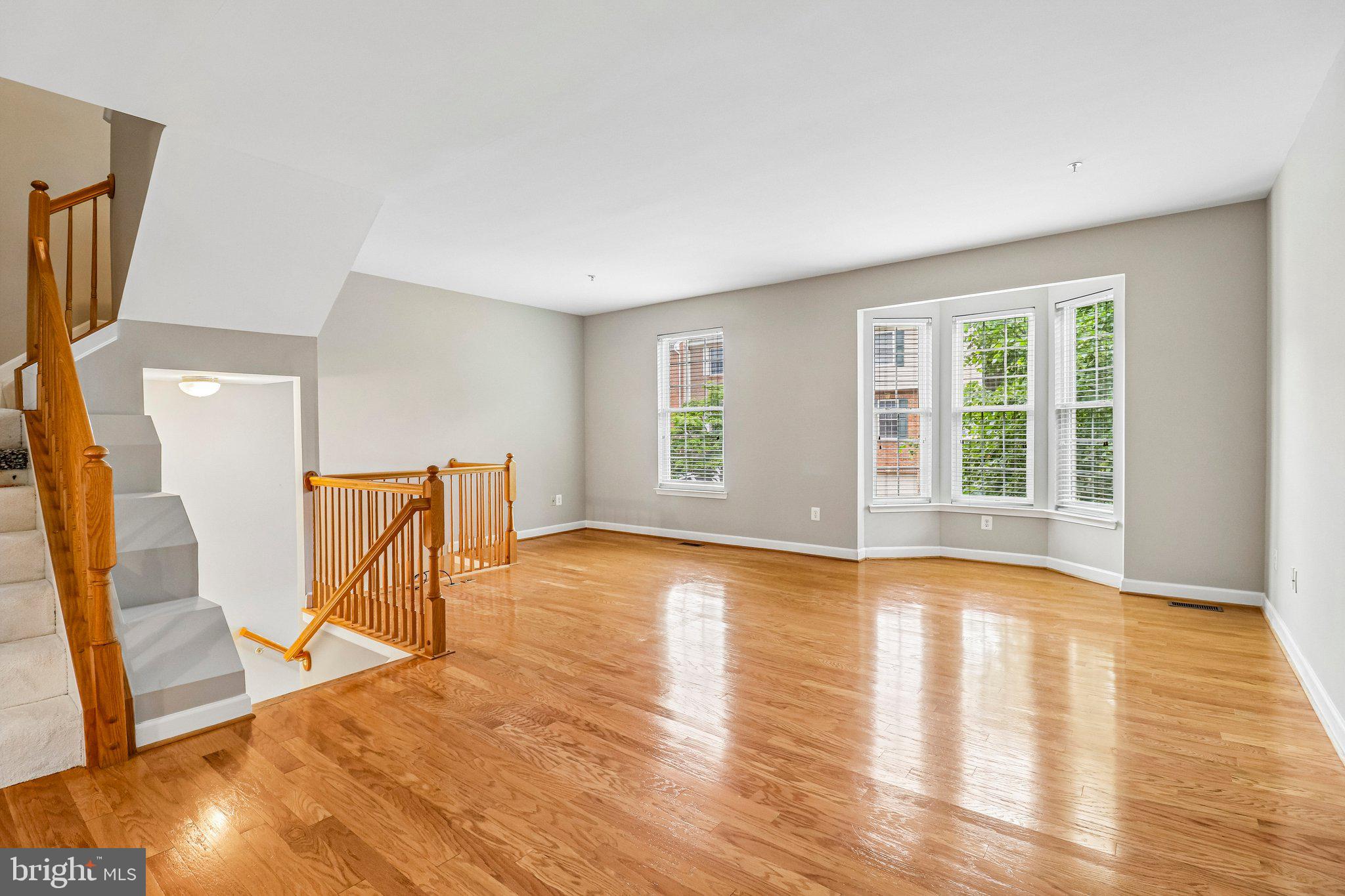 217 Braxton Way, Unit 217 Edgewater, MD 21037 - Photo 3 of 27 a view of a livingroom with wooden floor and a window