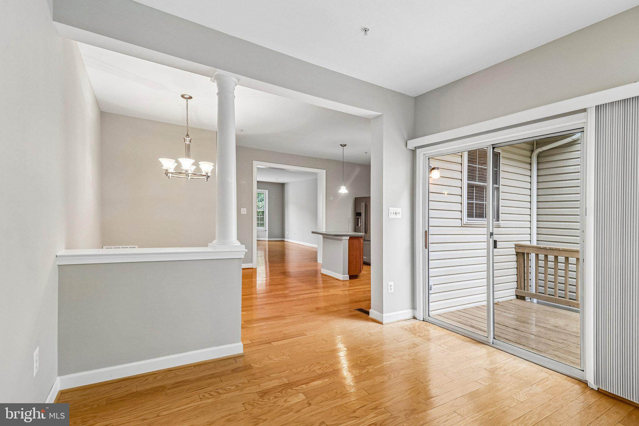217 Braxton Way, Unit 217 Edgewater, MD 21037 - Photo 8 of 27 a view of a hallway with wooden floor and a bathroom