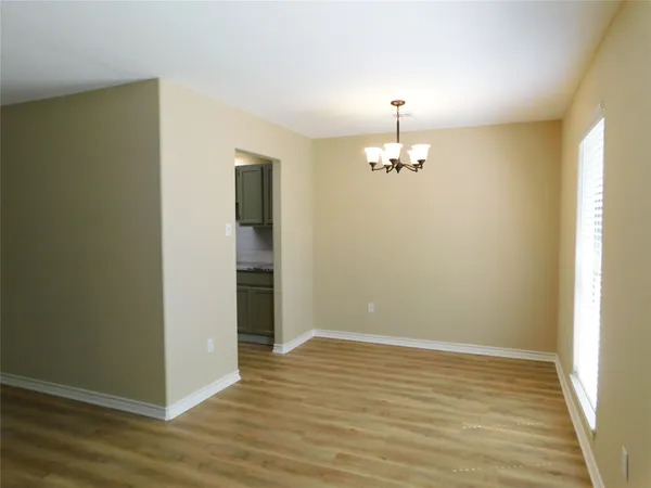 a kitchen with stainless steel appliances granite countertop a refrigerator a stove and a sink