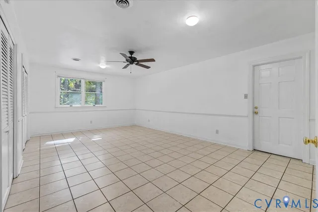 a view of an empty room and window
