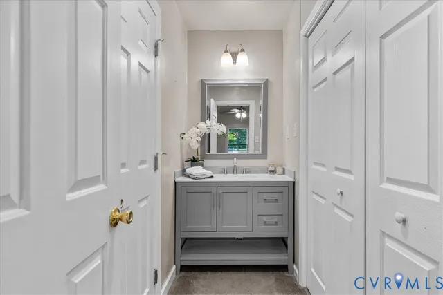 a bathroom with a double vanity sink and mirror