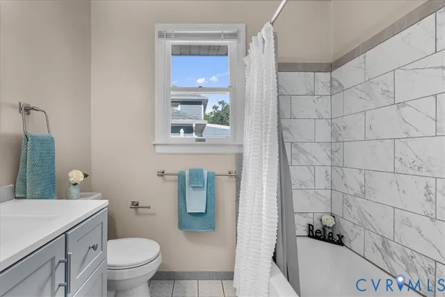 a bathroom with a toilet a sink and a shower