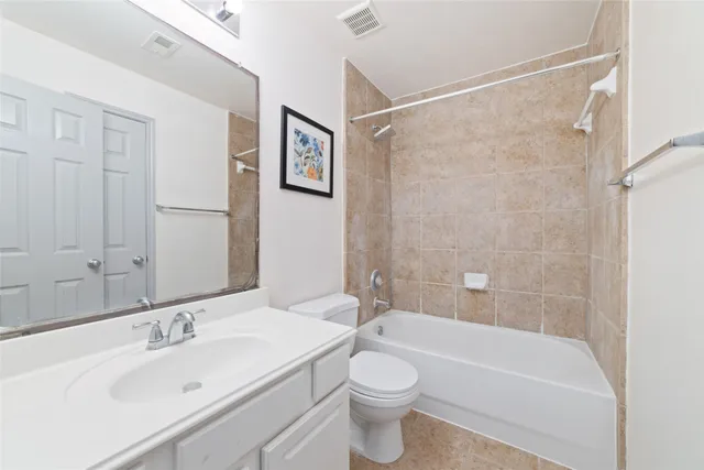 a bathroom with a sink a toilet and a bathtub