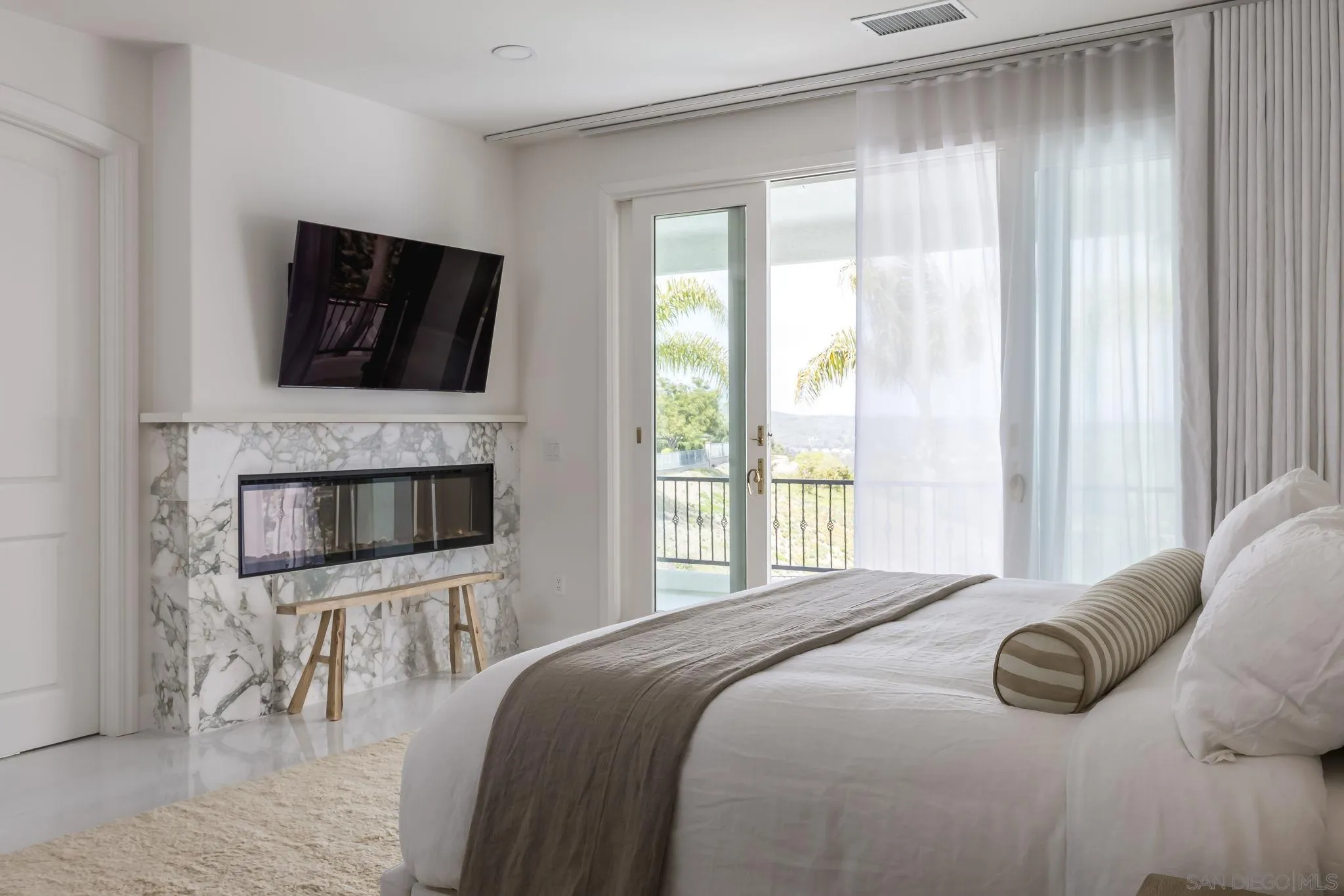12256 Berea Court Poway, CA 92064 - Photo 13 of 23 a bedroom with a large bed and a television