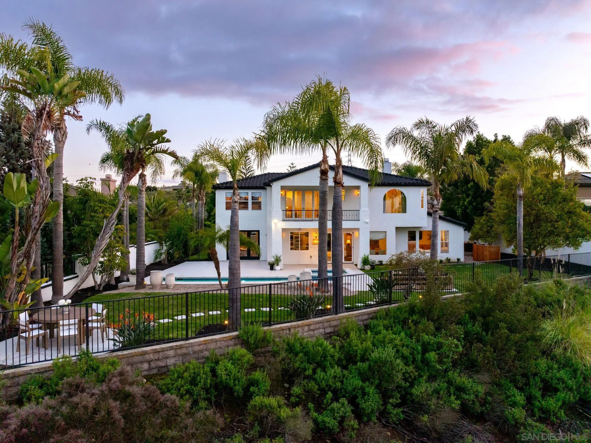 12256 Berea Court Poway, CA 92064 - Photo 21 of 23 a front view of a house with a yard and palm trees