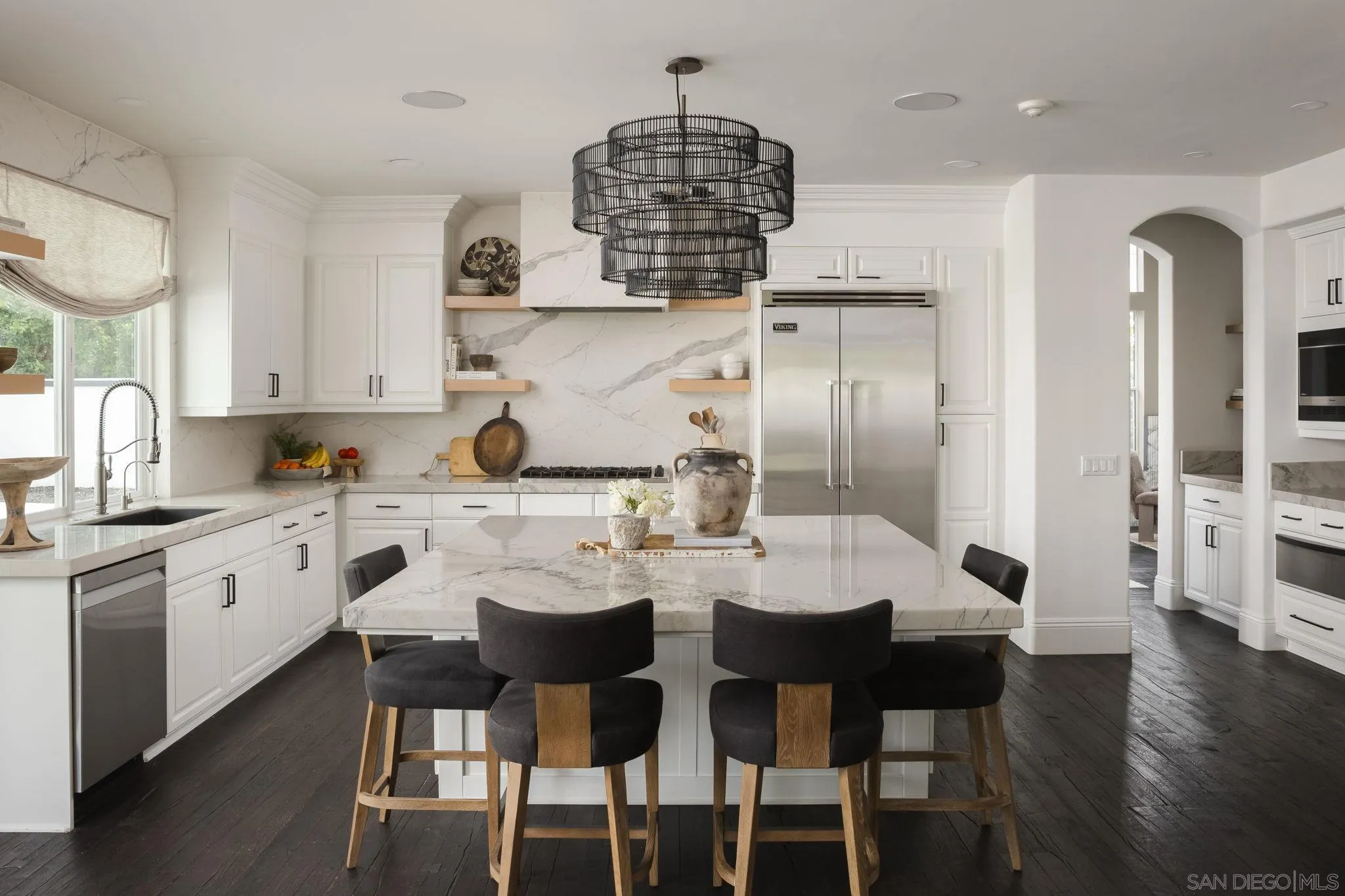 12256 Berea Court Poway, CA 92064 - Photo 5 of 23 a kitchen with stainless steel appliances a dining table chairs and stove