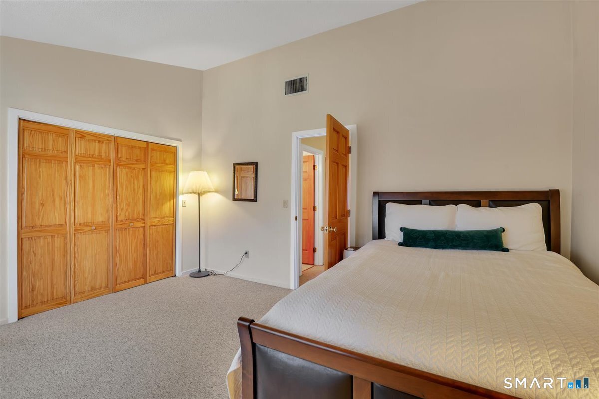 827 Oronoke Road, Unit 51 Waterbury, CT 06708 - Photo 12 of 24 2nd bedroom, another spacious bedroom with impressive closet in the whole wall.