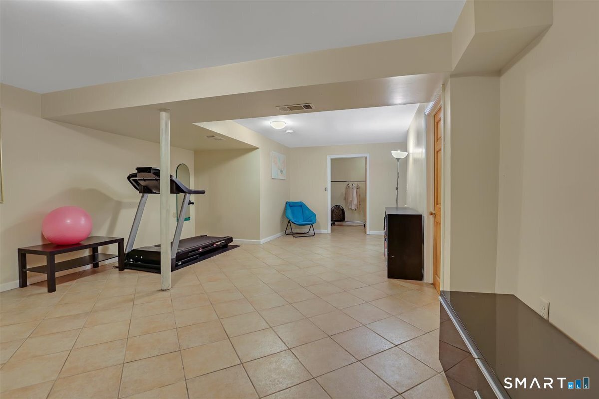 827 Oronoke Road, Unit 51 Waterbury, CT 06708 - Photo 16 of 24 Multi functional finished basement.