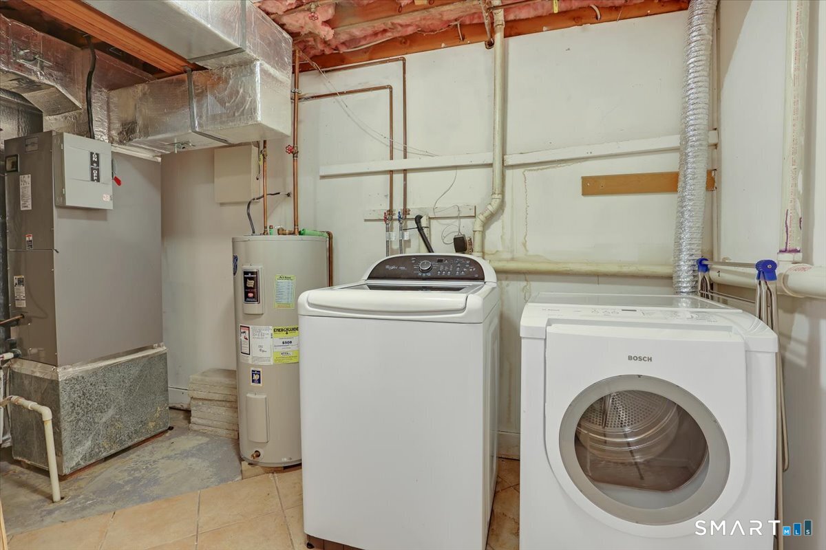 827 Oronoke Road, Unit 51 Waterbury, CT 06708 - Photo 17 of 24 Laundry room with abundant storage on the other side.