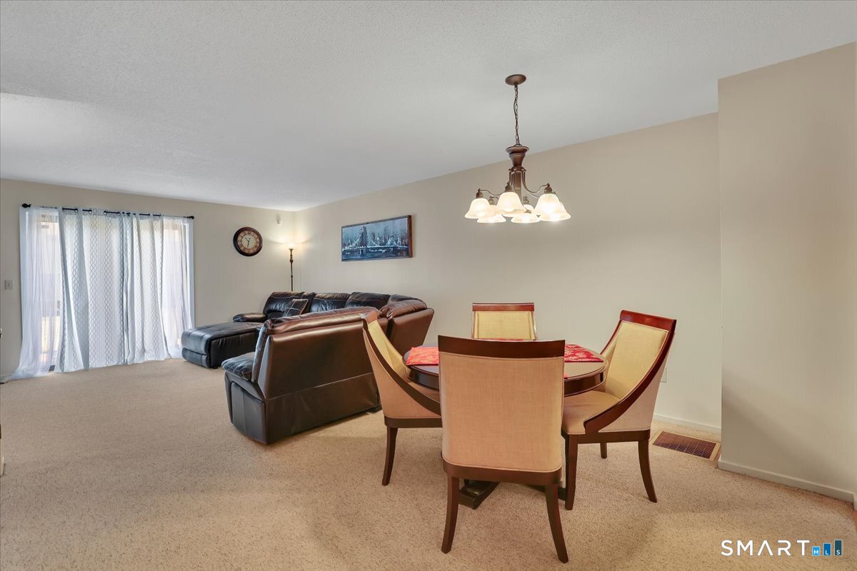 827 Oronoke Road, Unit 51 Waterbury, CT 06708 - Photo 19 of 24 Kitchen leads to the dining area.