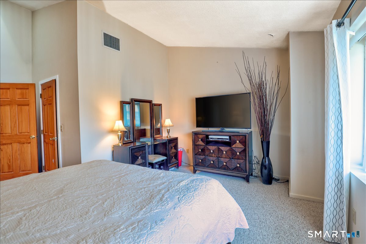 827 Oronoke Road, Unit 51 Waterbury, CT 06708 - Photo 23 of 24 Walk in closet in the primary bedroom