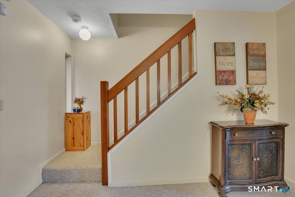 827 Oronoke Road, Unit 51 Waterbury, CT 06708 - Photo 7 of 24 Let's go to upstairs.