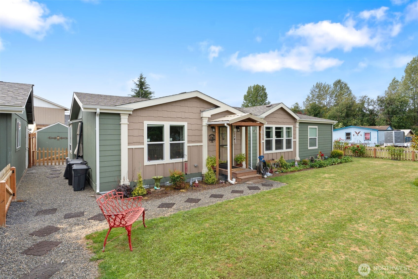 608 Main Street Vader, WA 98593 - Photo 3 of 37 a front view of house with a garden and patio