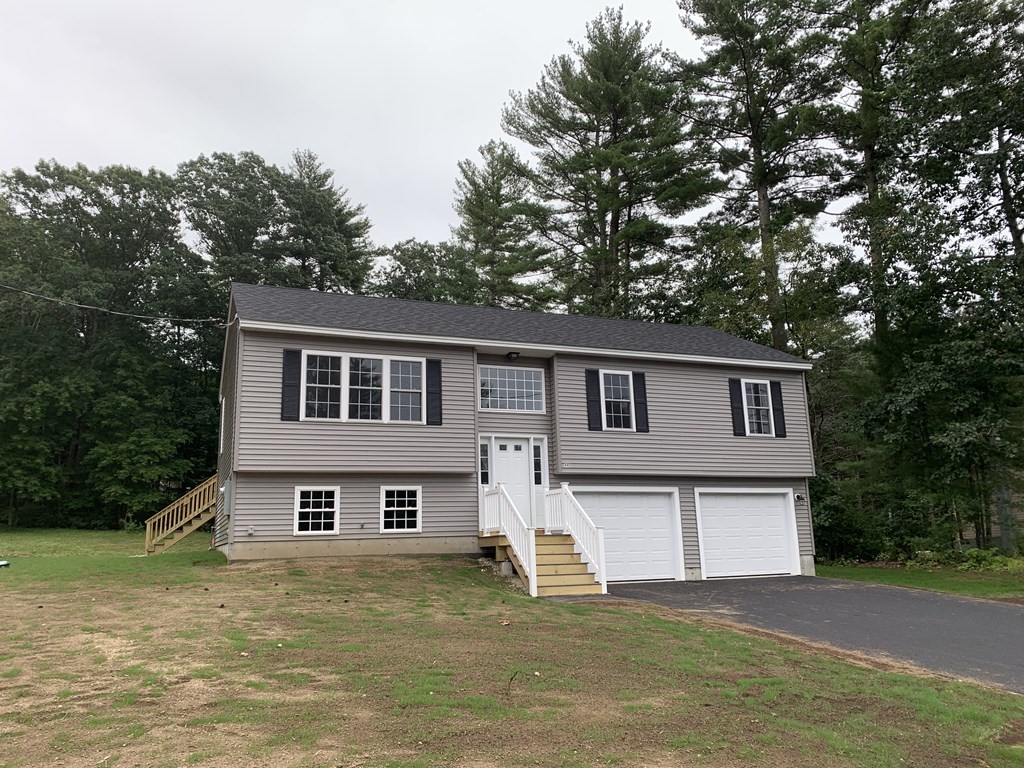 445 West Royalston Road Athol, MA 01331 - Photo 1 of 12 a house that has a tree in front of it