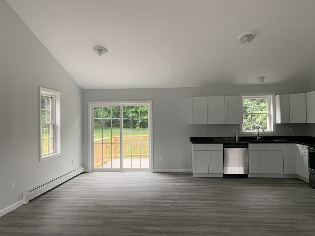 445 West Royalston Road Athol, MA 01331 - Photo 3 of 12 a kitchen with stainless steel appliances a stove top oven a sink and a window
