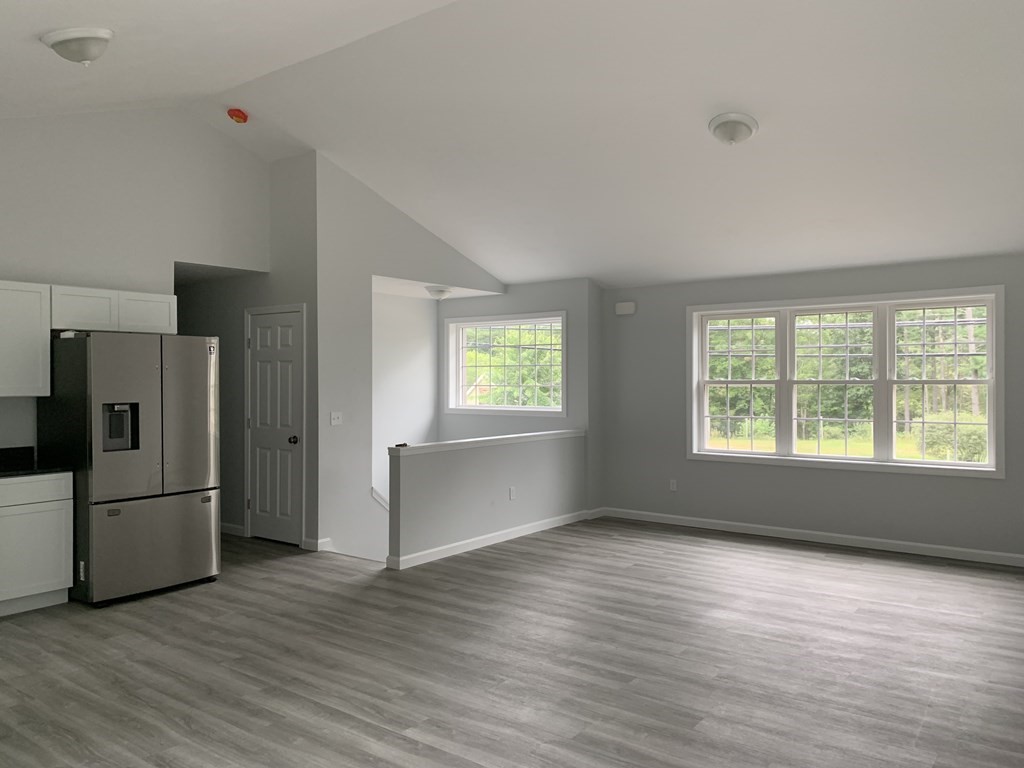 445 West Royalston Road Athol, MA 01331 - Photo 5 of 12 a view of an empty room with a window and wooden floor