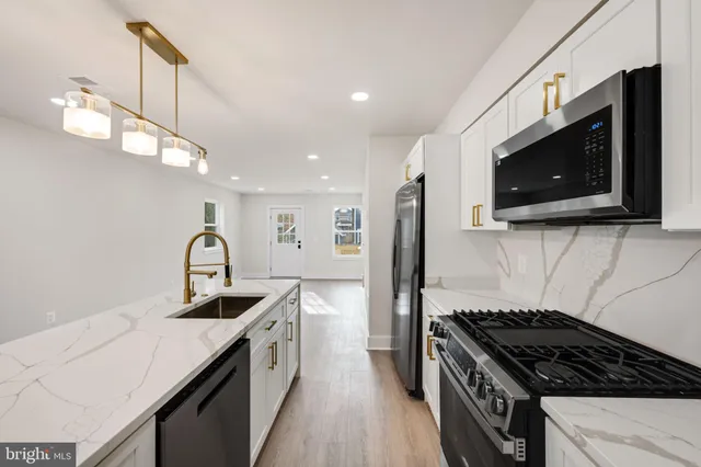 a close up of a stove sitting inside of a kitchen