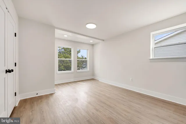a blue bench sitting in front of a building