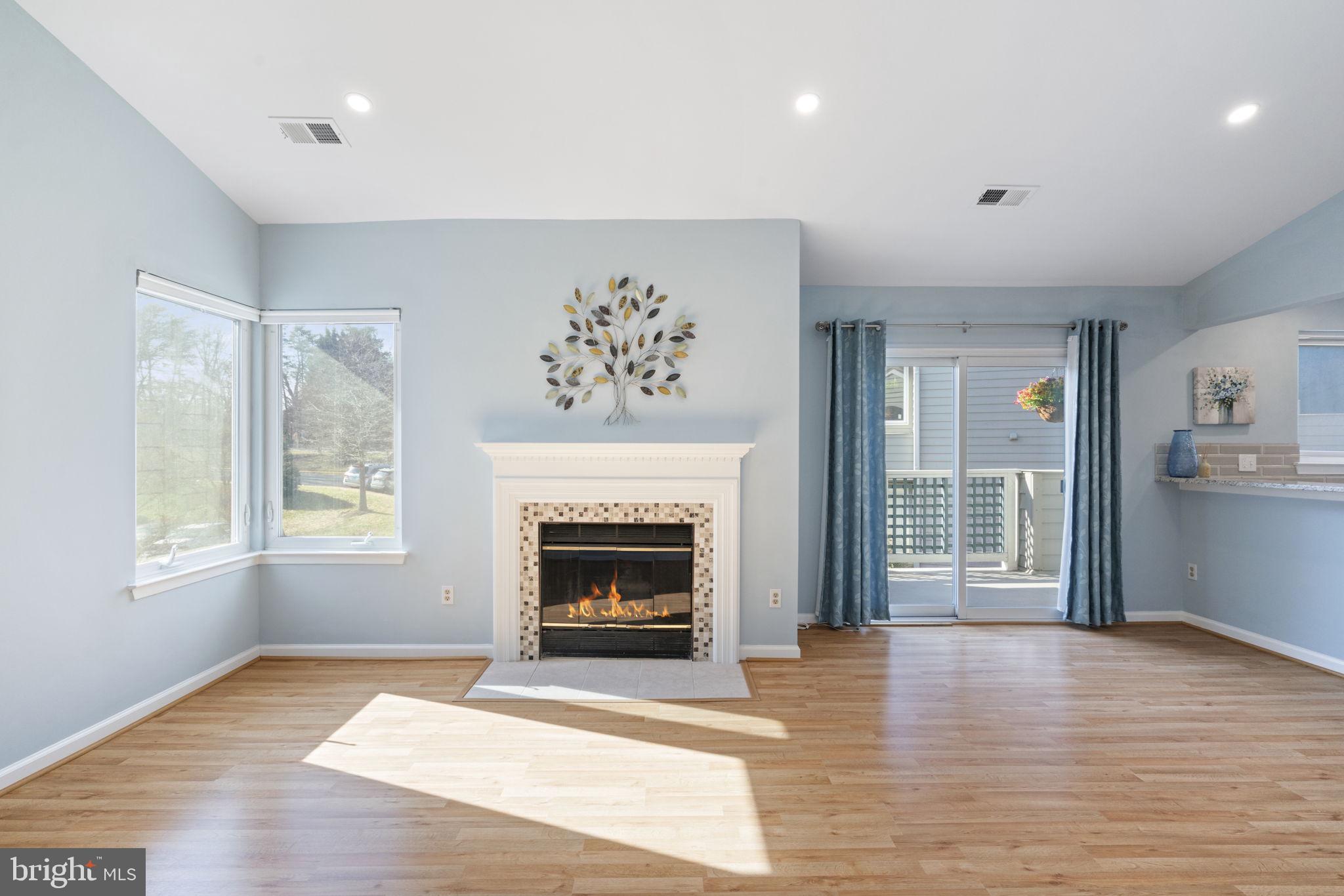 Wood-burning fireplace w/updated tile surround