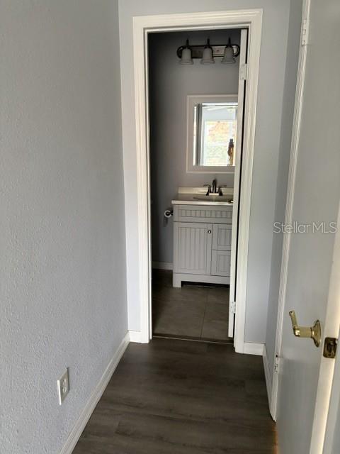 610 Kirkland Circle Dunedin, FL 34698 - Photo 16 of 28 a bathroom with a sink and a mirror