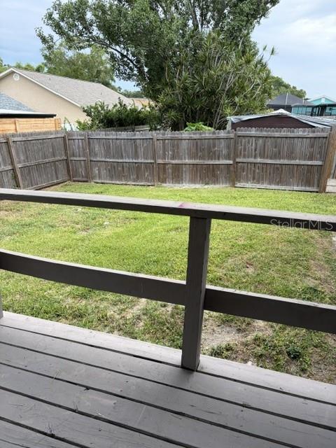 610 Kirkland Circle Dunedin, FL 34698 - Photo 25 of 28 a view of a backyard with a lake view