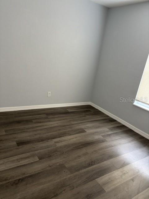 610 Kirkland Circle Dunedin, FL 34698 - Photo 6 of 28 a view of a room with wooden floor