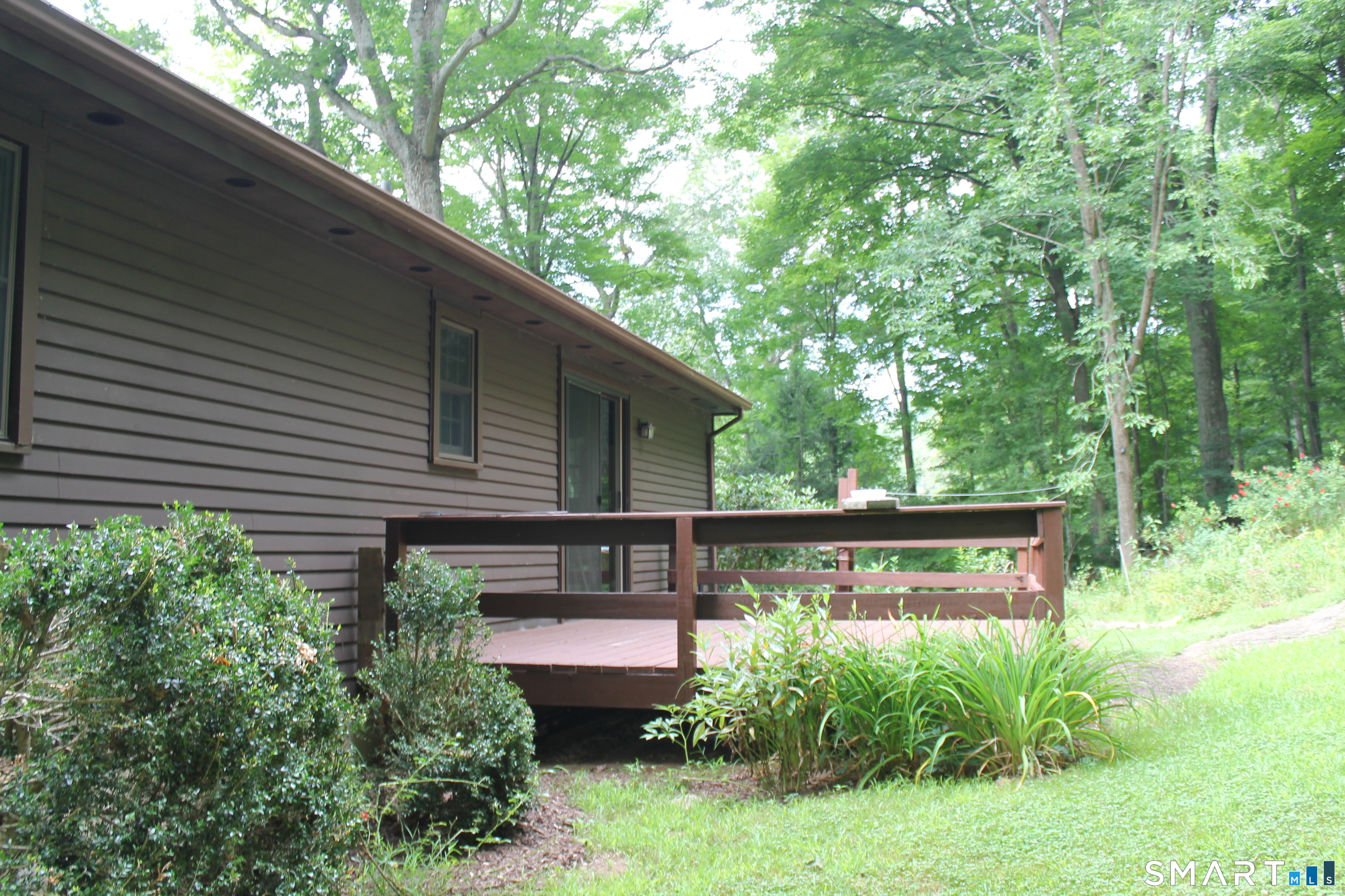 35 Pigeon Swamp Road, Unit 2 Lebanon, CT 06249 - Photo 5 of 35 a view of house with backyard sitting area and garden