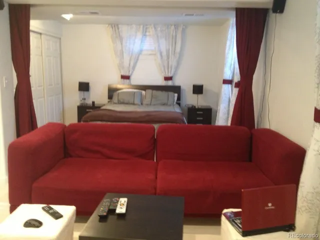 a living room with furniture and a window