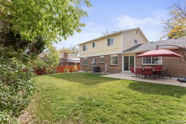 a view of a house with a yard porch and sitting area