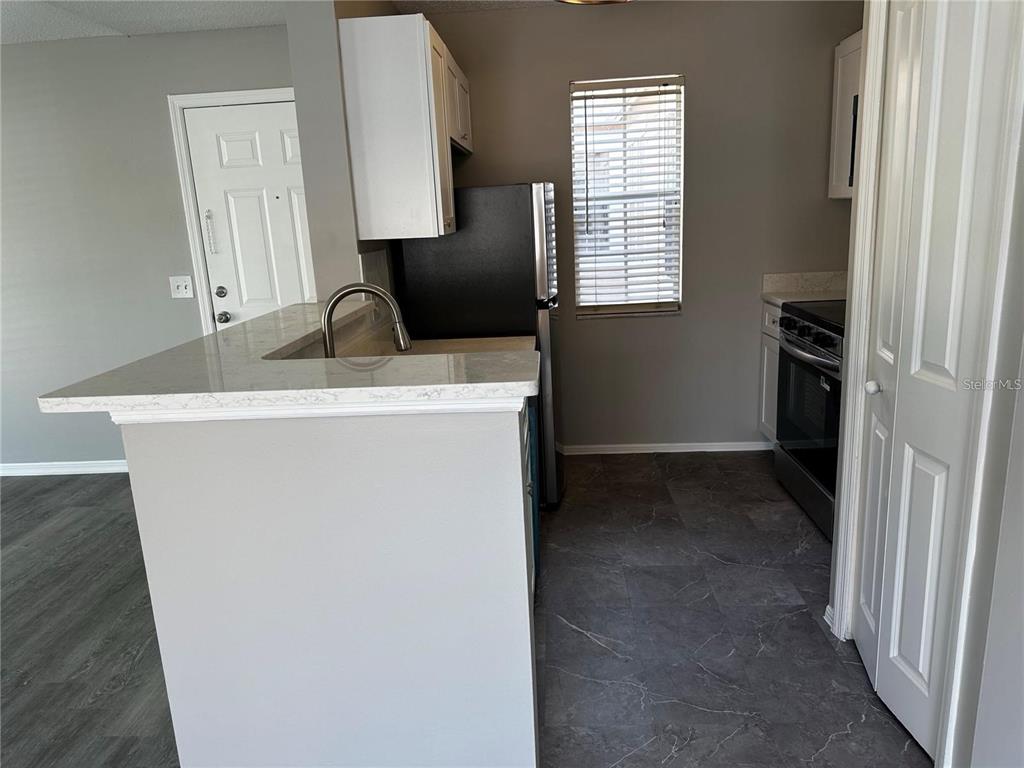 652 Roaring Drive, Unit 234 Altamonte Springs, FL 32714 - Photo 14 of 39 a view of a sink and a mirror